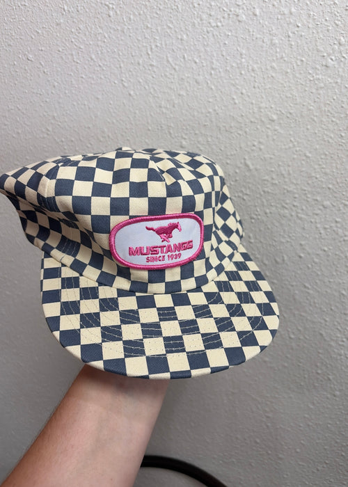 blue checkered cap with pink patch