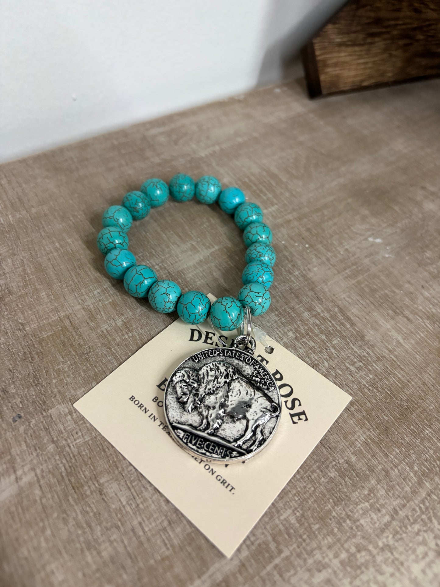 Buffalo coin with turquoise beads ￼