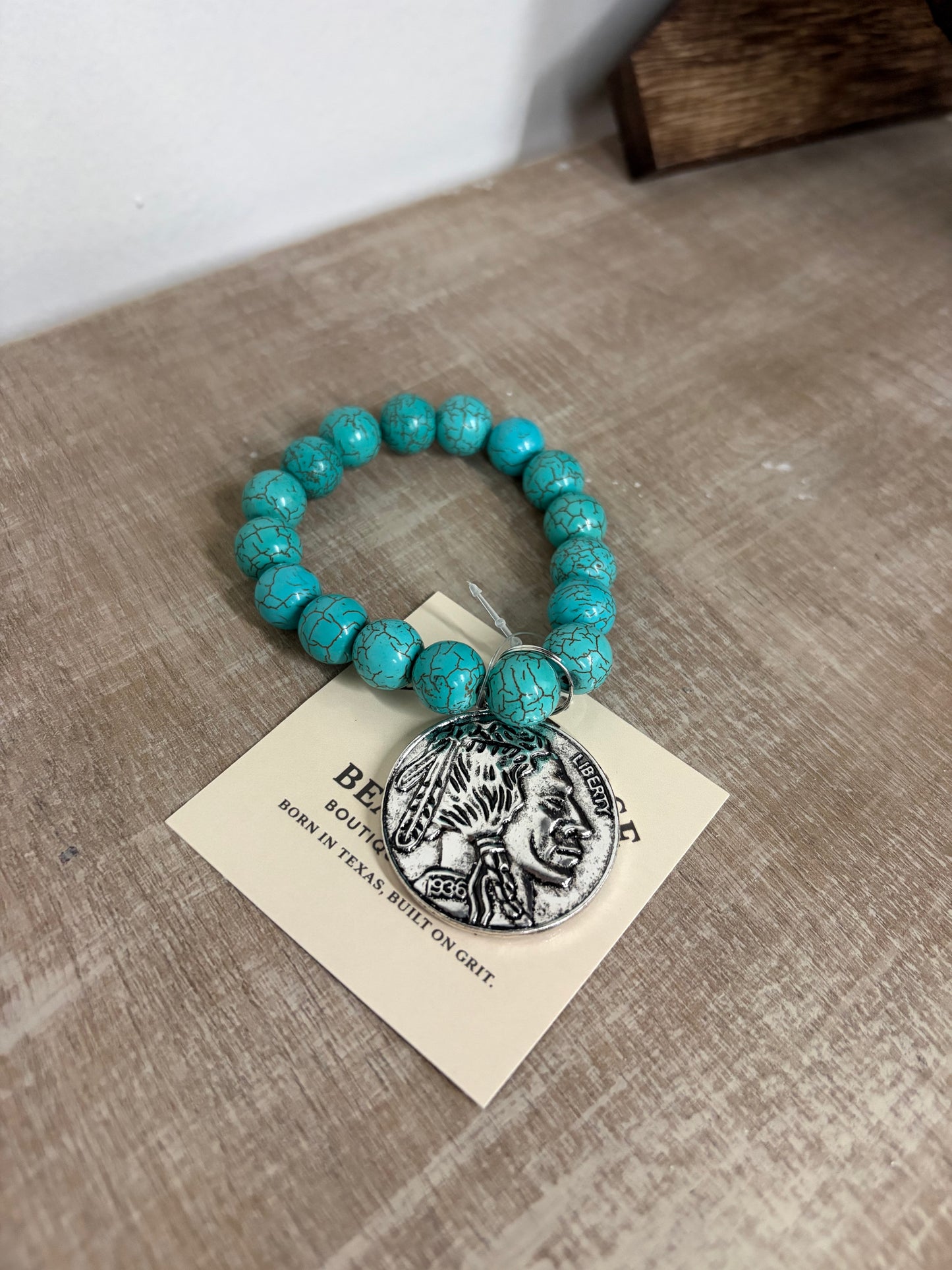 Buffalo coin with turquoise beads ￼
