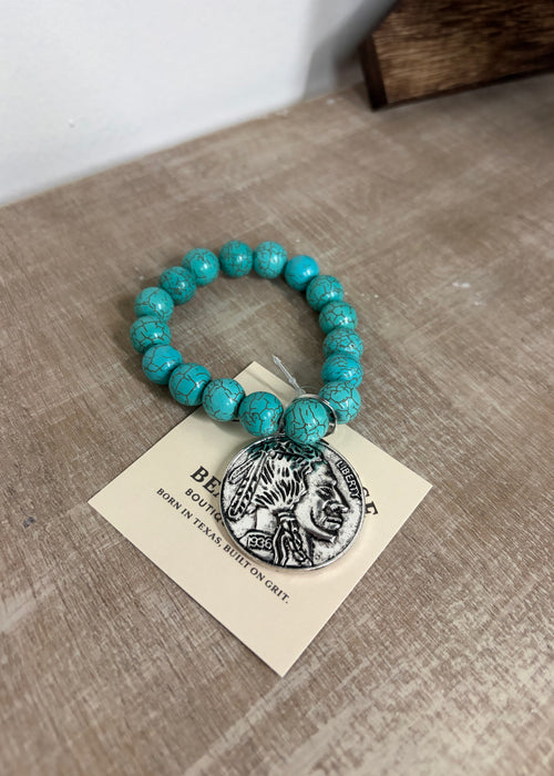 Buffalo coin with turquoise beads ￼