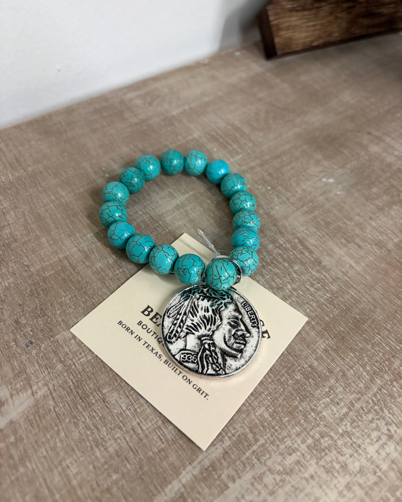Buffalo coin with turquoise beads ￼